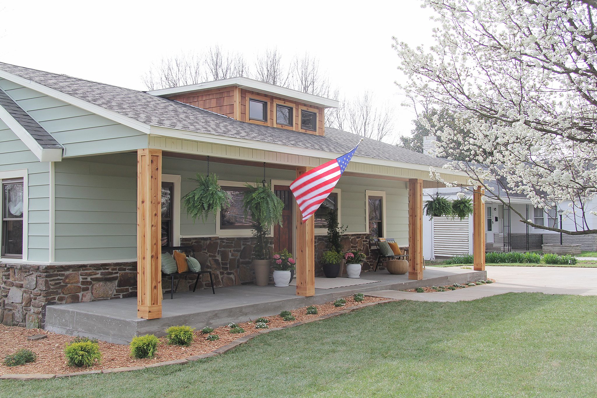 HGTV Fixer to Fabulous Exterior Renovation with beautiful front porch.