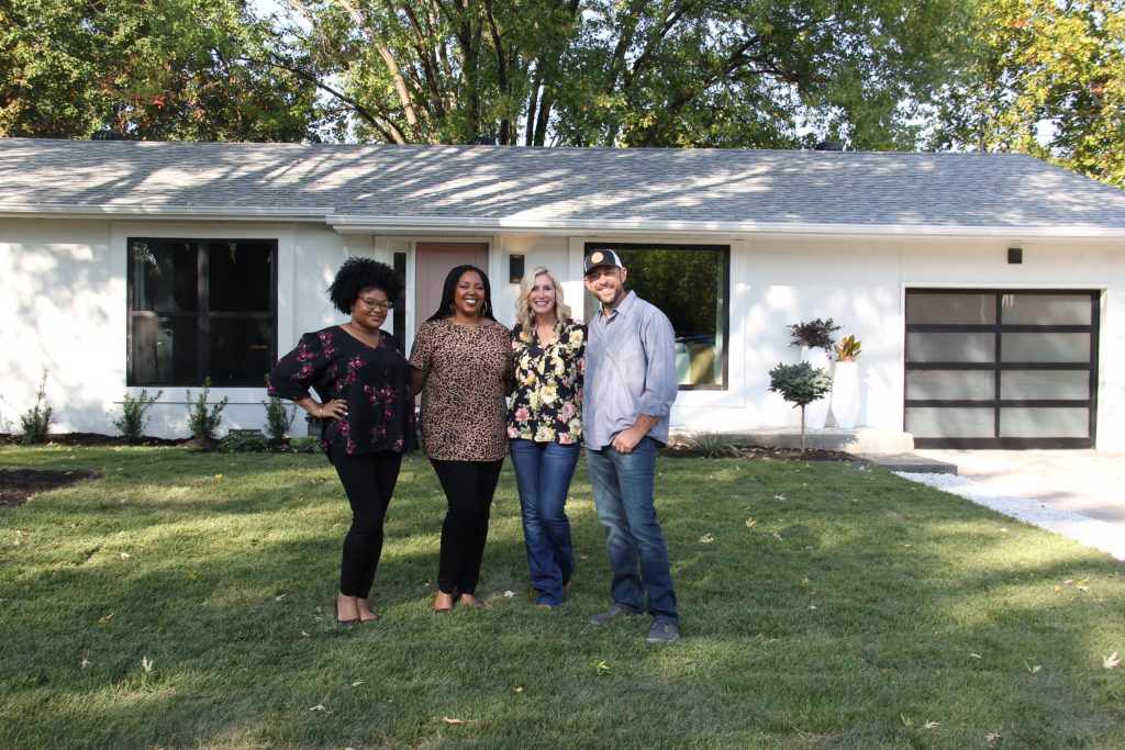 Jae and Jasmine with Dave and Jenny standing in front of renovated home